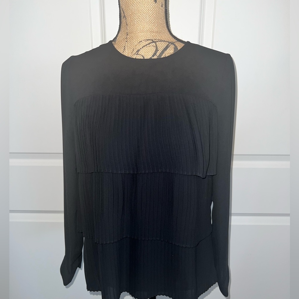 Long sleeve blouse, three tier razor plates. Super cute!